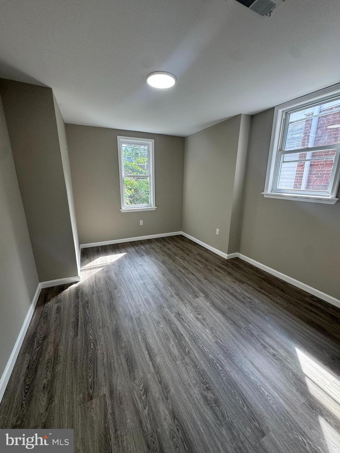 6018 Ross Street Philadelphia, PA 19144 - Photo 8 of 14 a view of an empty room with wooden floor and a window