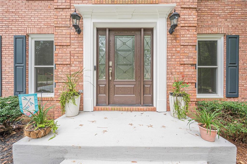 461 Braidwood Walk Northwest Acworth, GA 30101 - Photo 18 of 67 a front view of a house with a yard