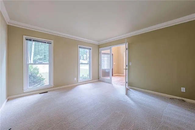 a kitchen with stainless steel appliances granite countertop a refrigerator a stove and a sink with wooden floor