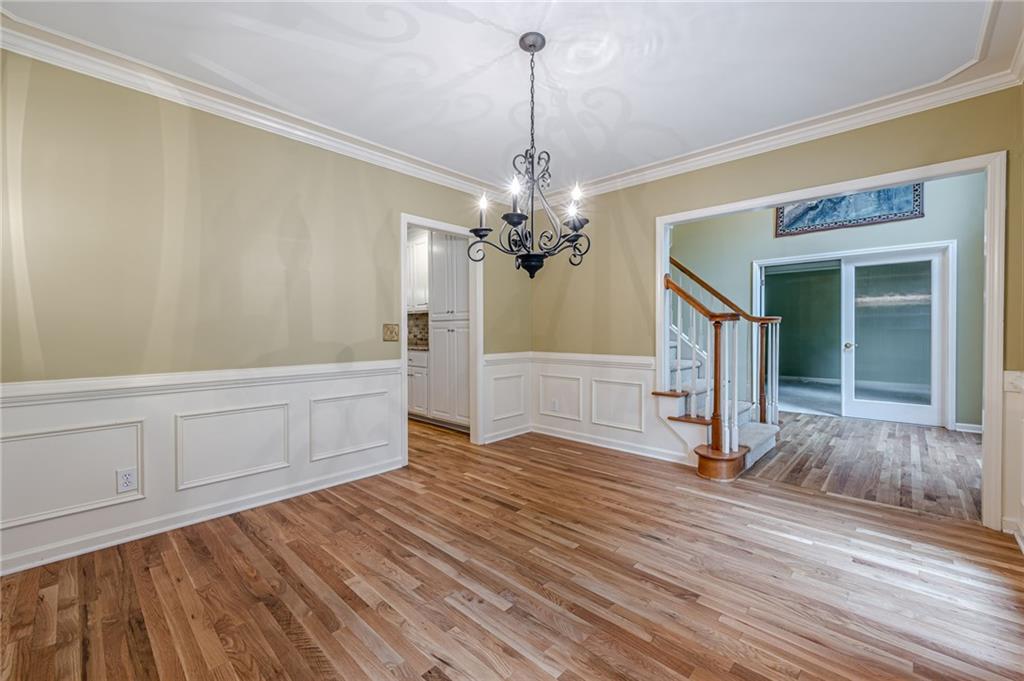 461 Braidwood Walk Northwest Acworth, GA 30101 - Photo 26 of 67 a view of a room with wooden floor and staircase