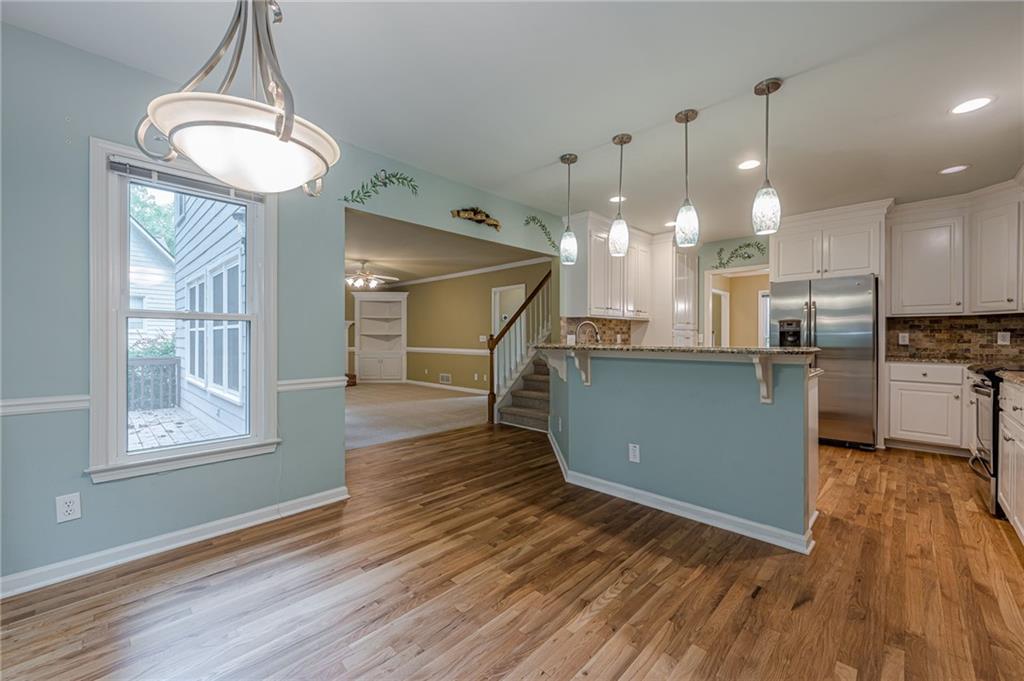 461 Braidwood Walk Northwest Acworth, GA 30101 - Photo 32 of 67 a kitchen with counter top space a sink and appliances