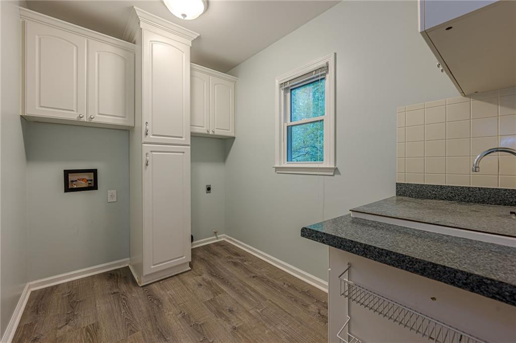 461 Braidwood Walk Northwest Acworth, GA 30101 - Photo 33 of 67 a view of a livingroom with wooden floor and a window