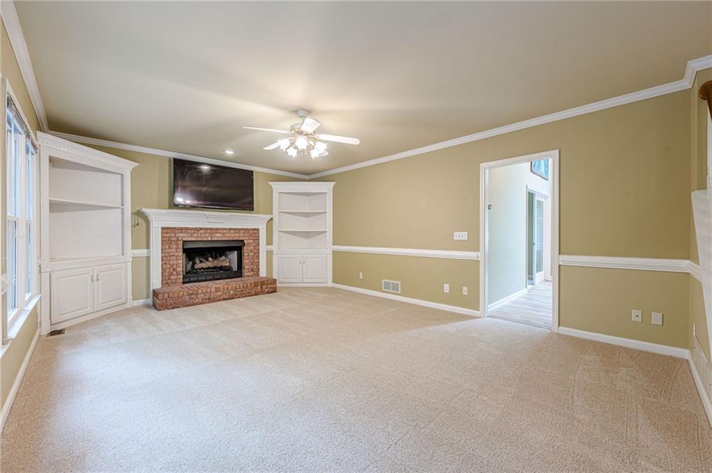 461 Braidwood Walk Northwest Acworth, GA 30101 - Photo 35 of 67 a view of empty room with a fireplace and fan