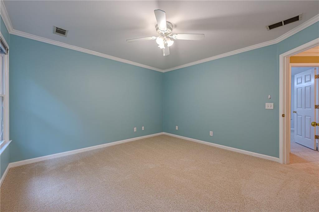 461 Braidwood Walk Northwest Acworth, GA 30101 - Photo 40 of 67 an empty room with a chandelier fan and windows