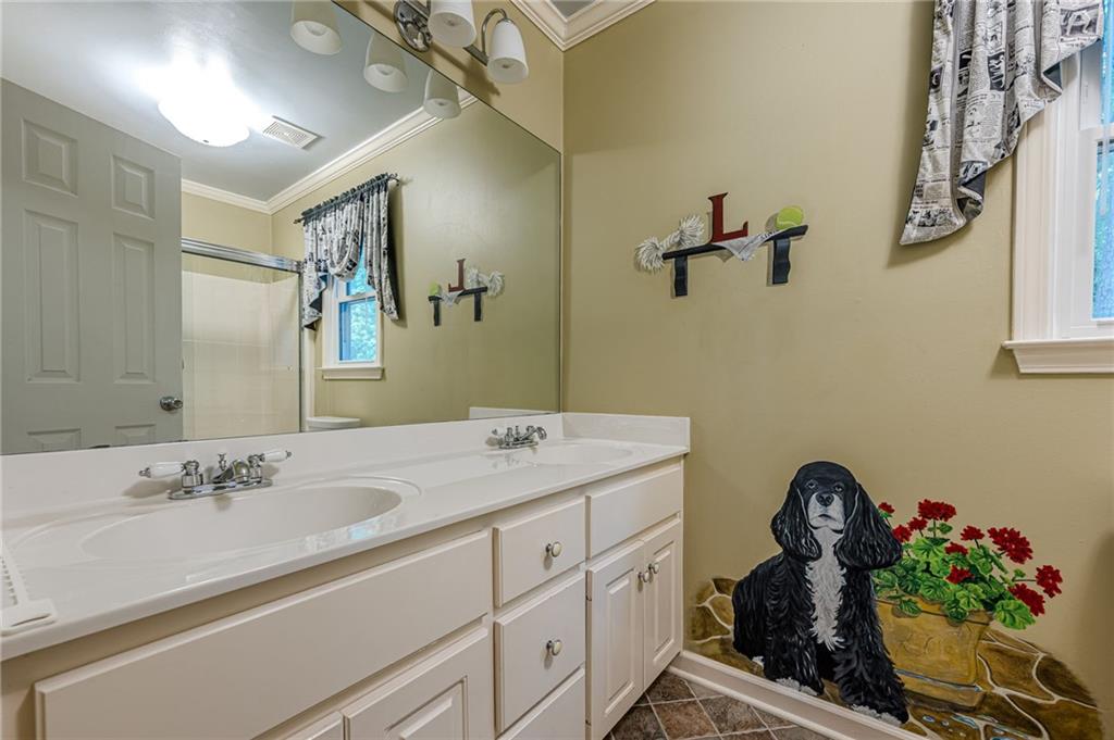 461 Braidwood Walk Northwest Acworth, GA 30101 - Photo 45 of 67 a bathroom with a sink double vanity and a mirror