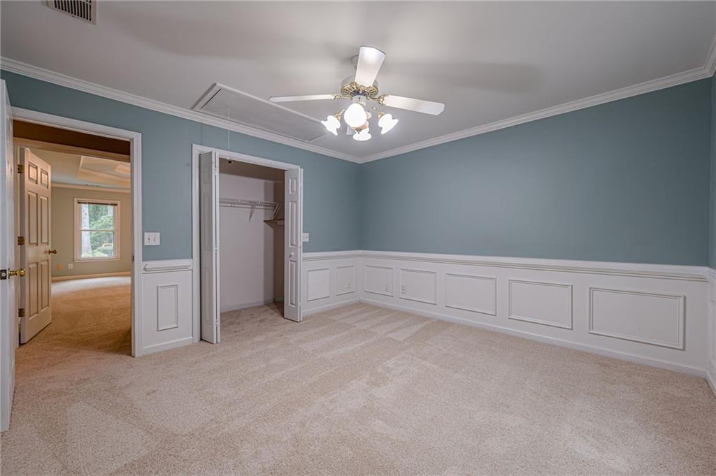 461 Braidwood Walk Northwest Acworth, GA 30101 - Photo 48 of 67 a view of an empty room with chandelier fan