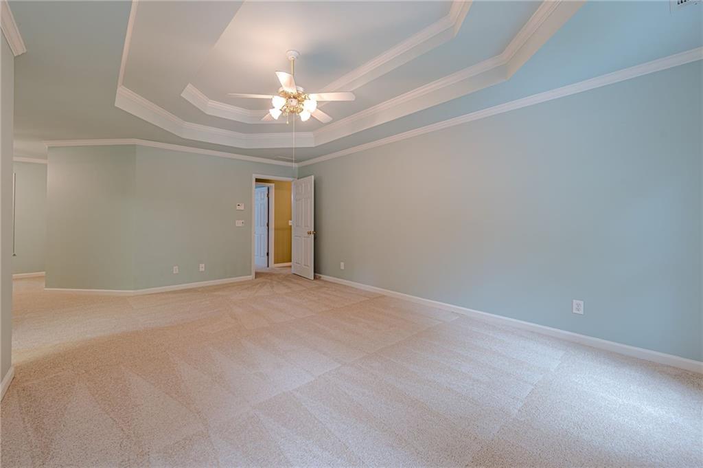 461 Braidwood Walk Northwest Acworth, GA 30101 - Photo 49 of 67 a view of an empty room with a chandelier fan
