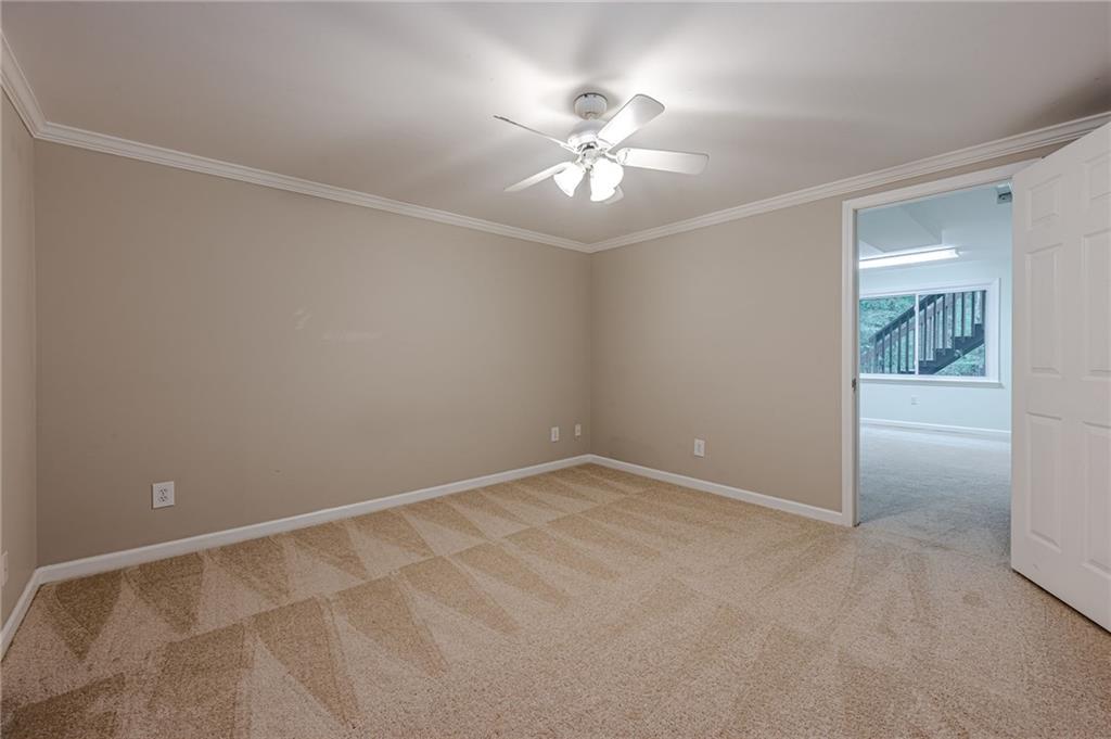 461 Braidwood Walk Northwest Acworth, GA 30101 - Photo 55 of 67 an empty room with windows and fan