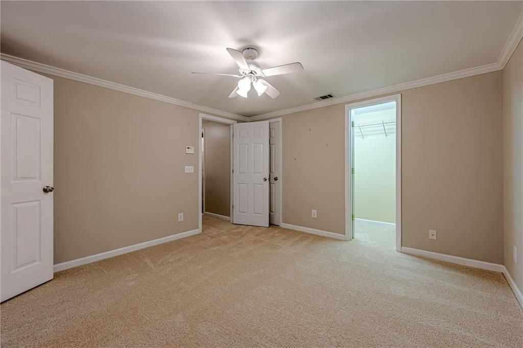 461 Braidwood Walk Northwest Acworth, GA 30101 - Photo 56 of 67 a view of an empty room with a ceiling fan