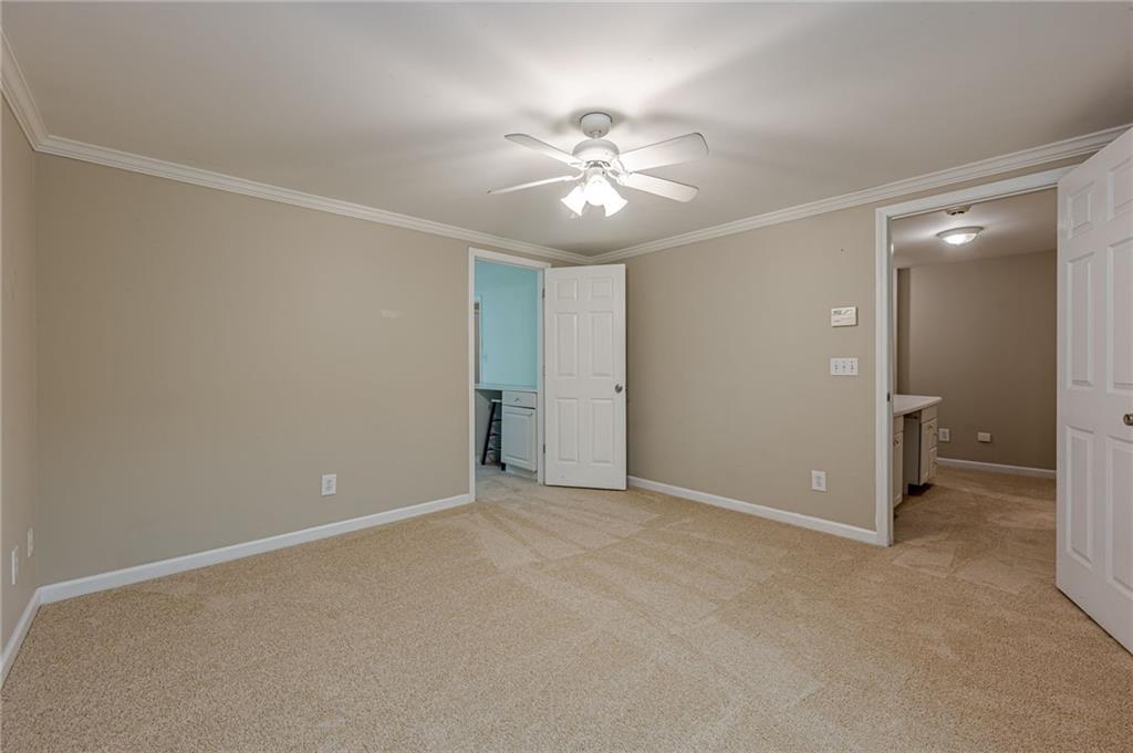 461 Braidwood Walk Northwest Acworth, GA 30101 - Photo 57 of 67 an empty room with closet and a ceiling fan