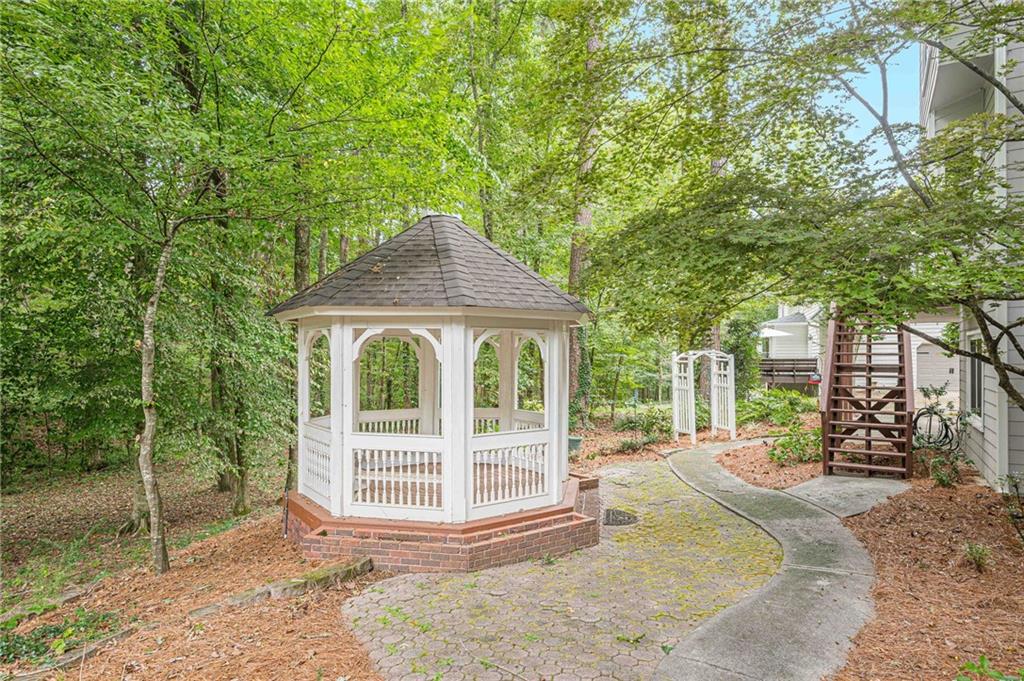 461 Braidwood Walk Northwest Acworth, GA 30101 - Photo 62 of 67 a view of a house with backyard and sitting area