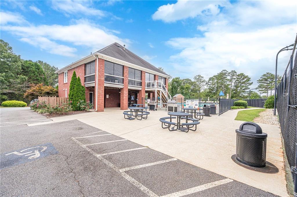 461 Braidwood Walk Northwest Acworth, GA 30101 - Photo 67 of 67 a view of a patio with couches table and chairs and potted plants