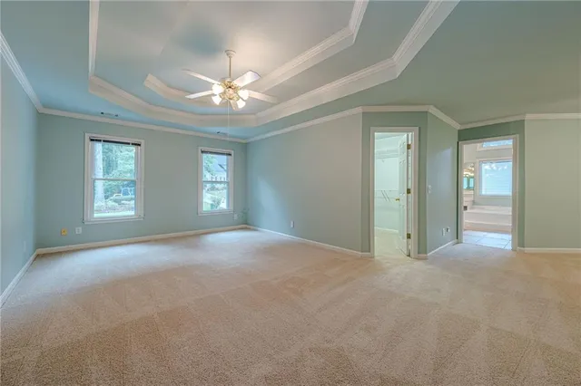 a spacious bathroom with a granite countertop tub sink and mirror