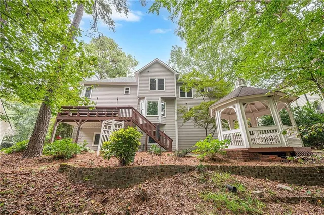 a kitchen with a refrigerator stove and white cabinets