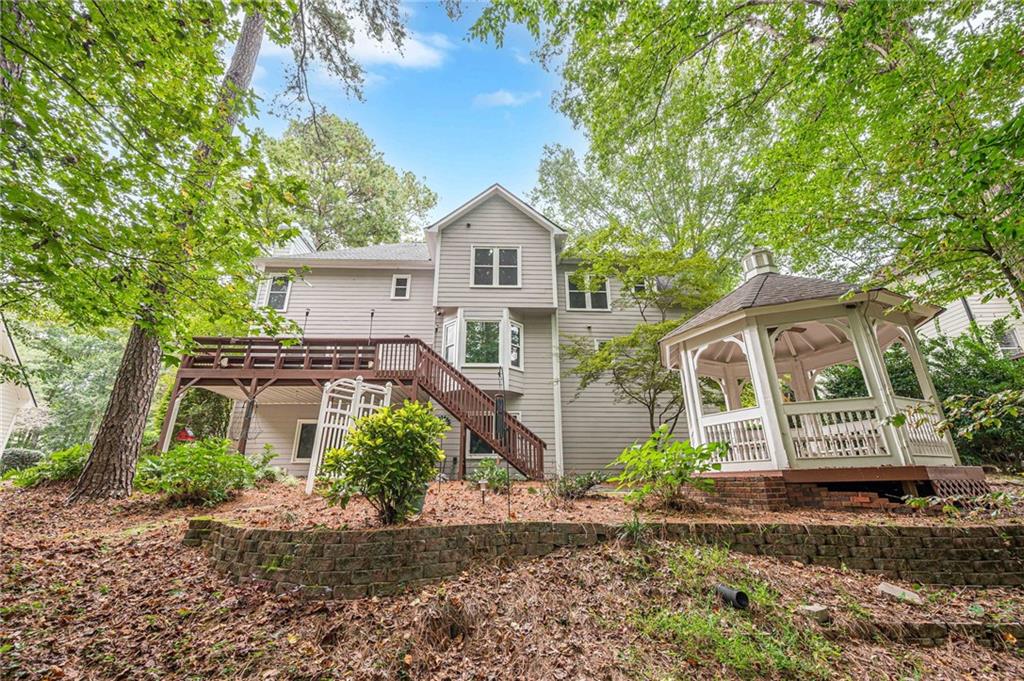 461 Braidwood Walk Northwest Acworth, GA 30101 - Photo 9 of 67 a front view of a house with garden