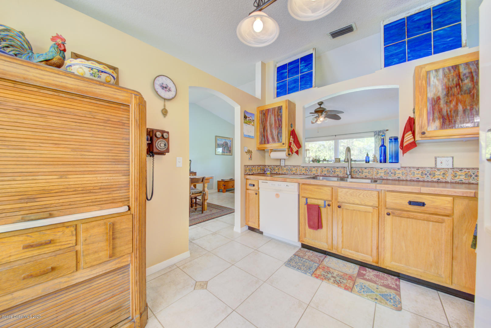 984 Ray Road Southeast Palm Bay, FL 32909 - Photo 22 of 45 a bathroom with a sink a mirror and a shower