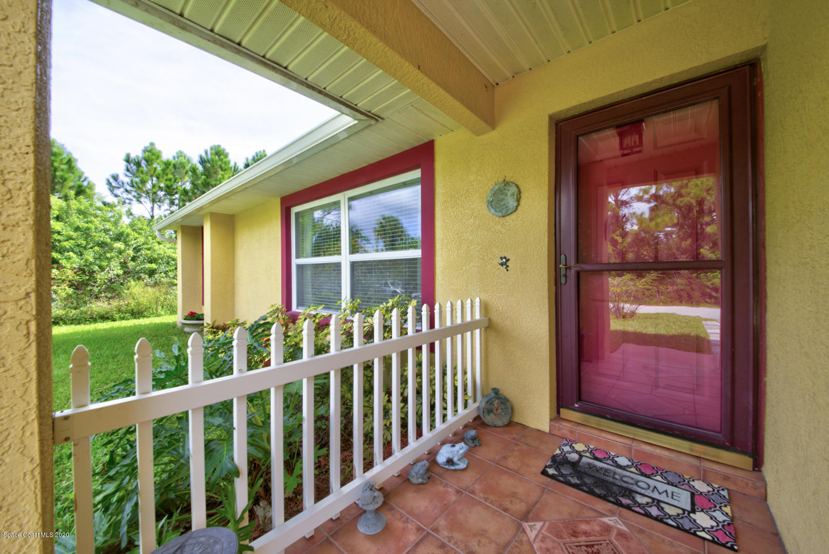 984 Ray Road Southeast Palm Bay, FL 32909 - Photo 8 of 45 a view of a front door