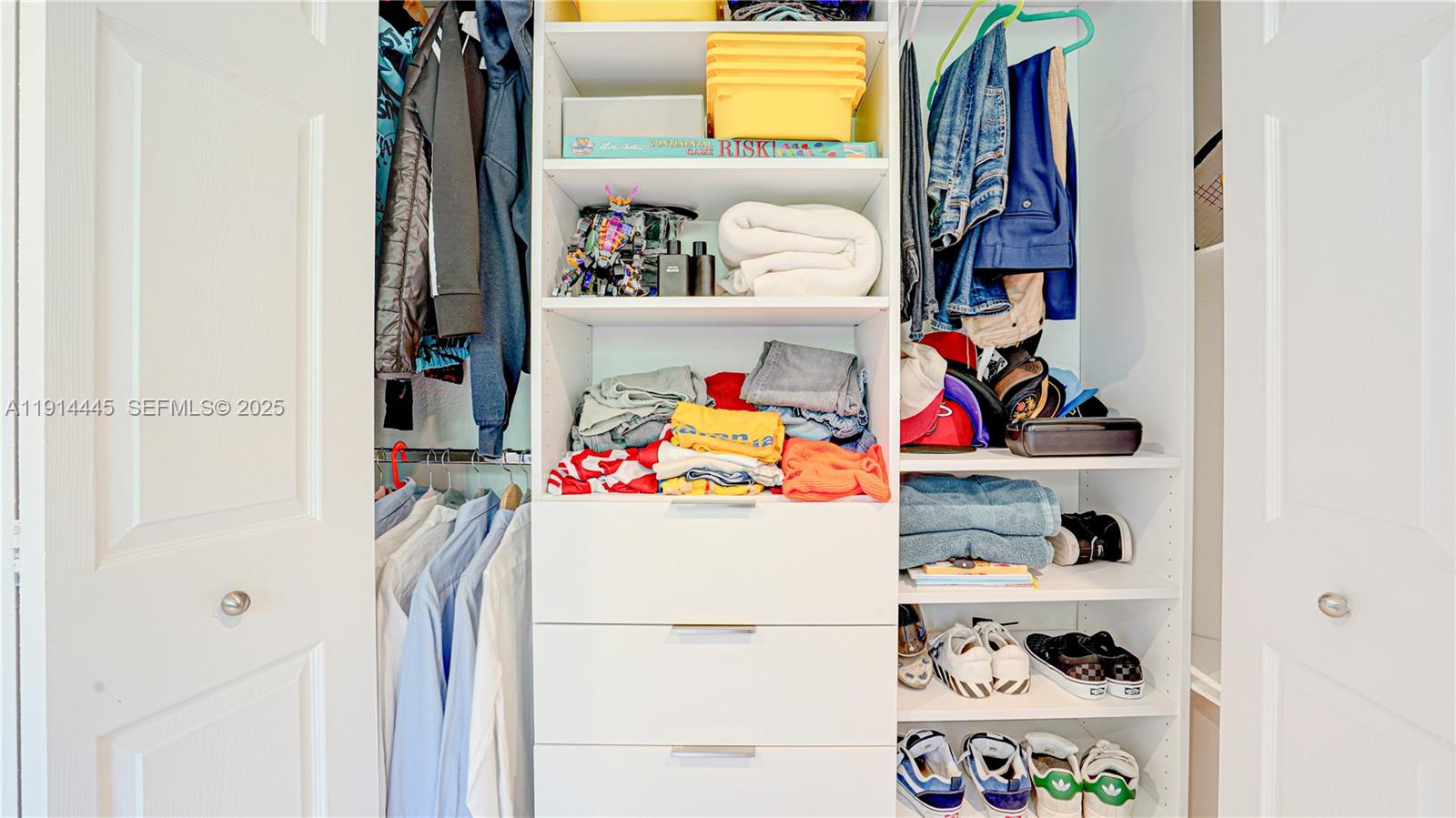 9573 Southwest 57th Street Miami, FL 33173 - Photo 13 of 34 a utility room with fridge and bed