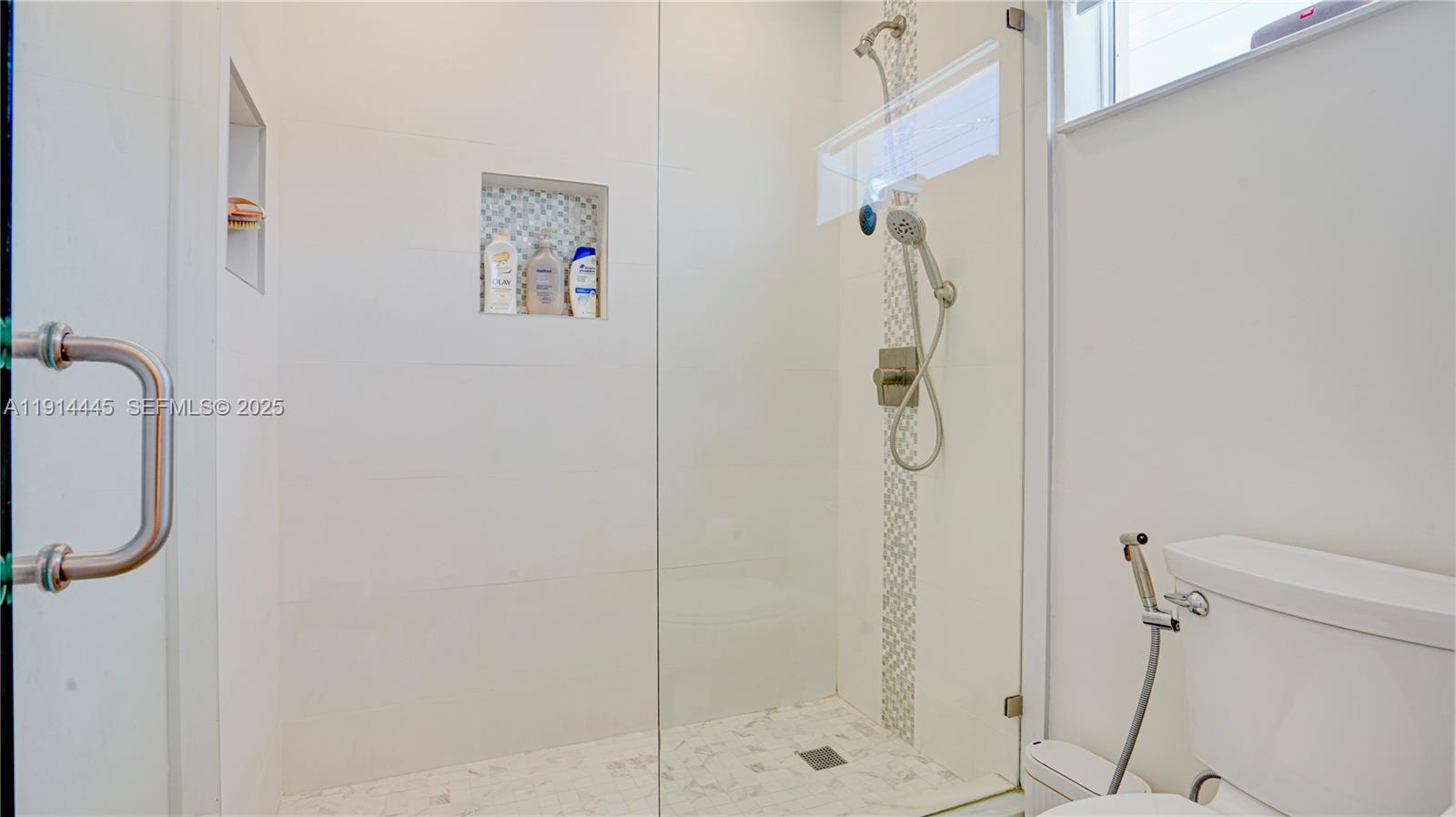 9573 Southwest 57th Street Miami, FL 33173 - Photo 21 of 34 a bathroom with a shower