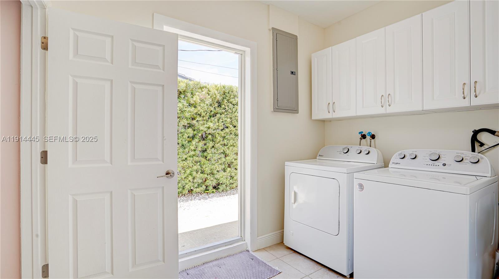 9573 Southwest 57th Street Miami, FL 33173 - Photo 25 of 34 a view of storage and utility room with washer and dryer