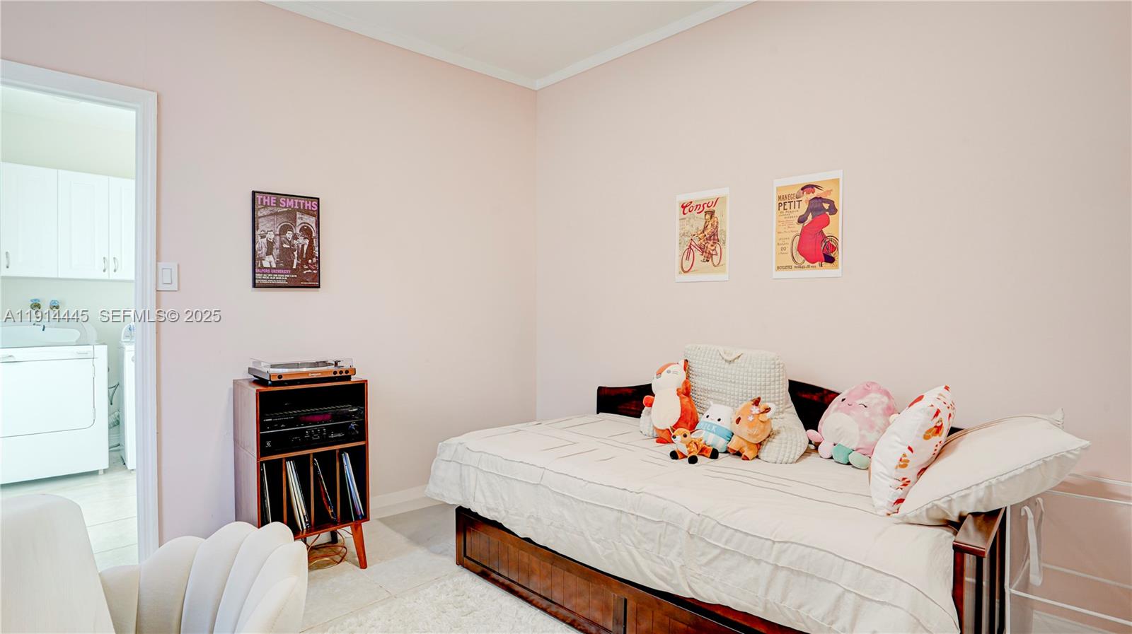 9573 Southwest 57th Street Miami, FL 33173 - Photo 27 of 34 a bed room with a bed and a desk