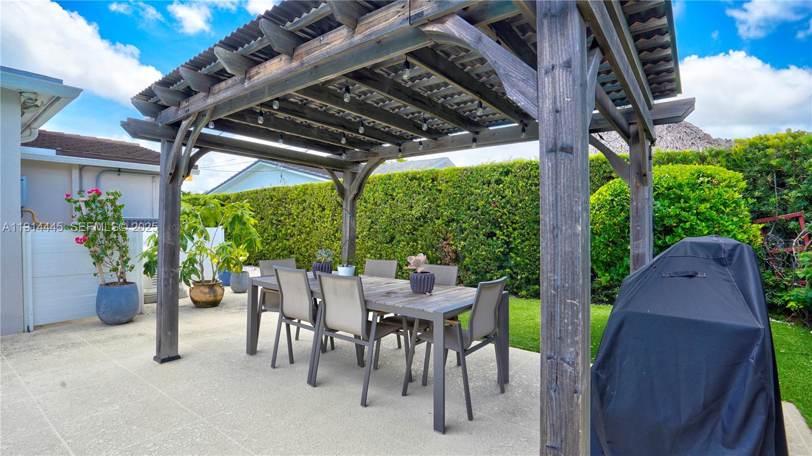 9573 Southwest 57th Street Miami, FL 33173 - Photo 32 of 34 a view of an outdoor space with furniture and garden