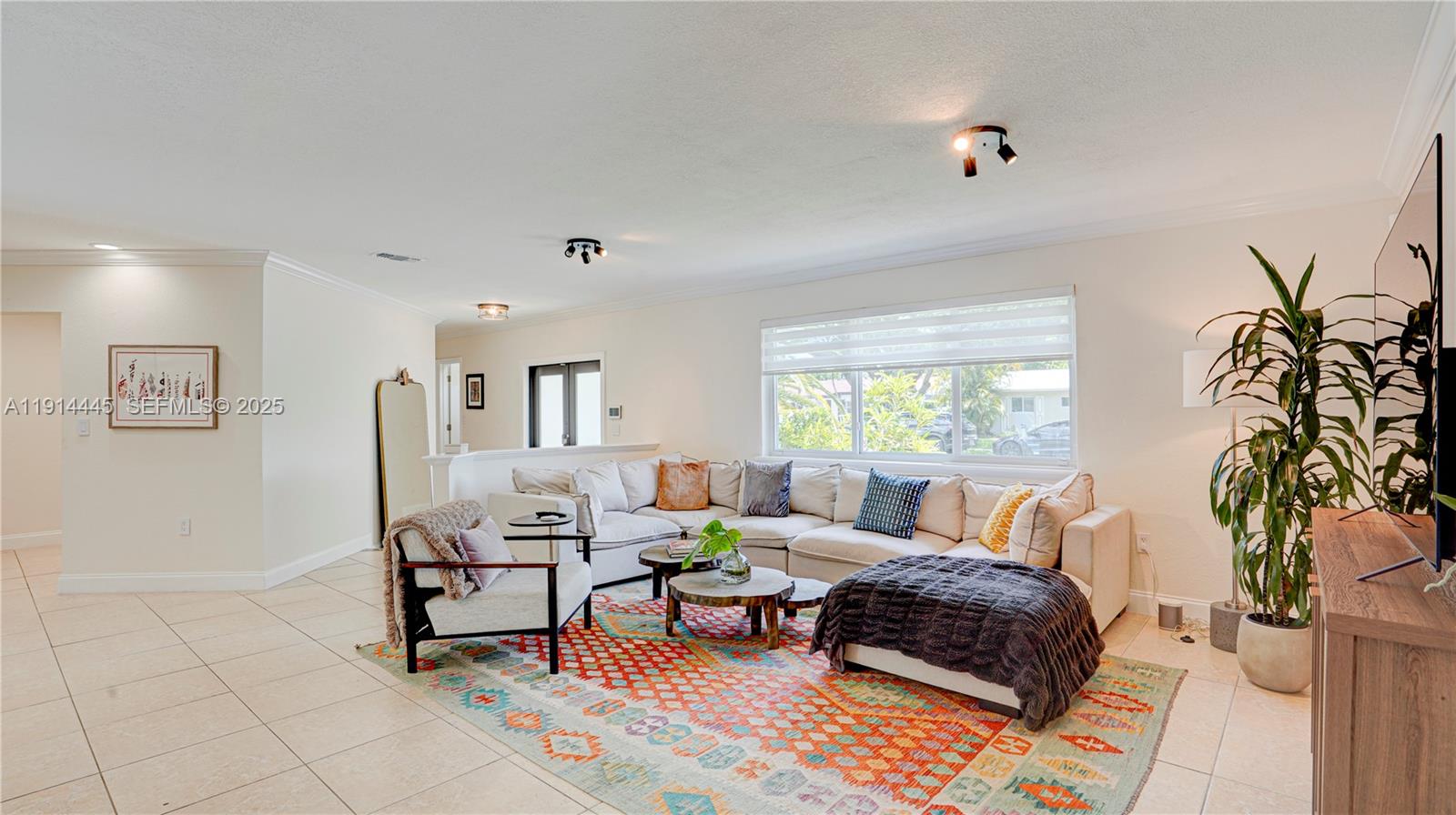 9573 Southwest 57th Street Miami, FL 33173 - Photo 5 of 34 a living room with furniture and a potted plant