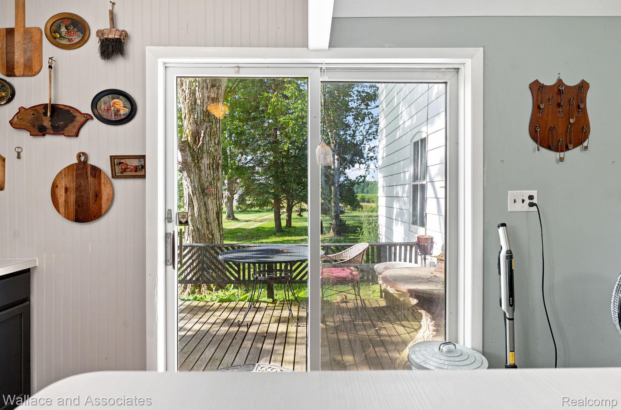 5949 Roach Road Croswell, MI 48422 - Photo 12 of 48 Sliding glass door opening to an outdoor deck