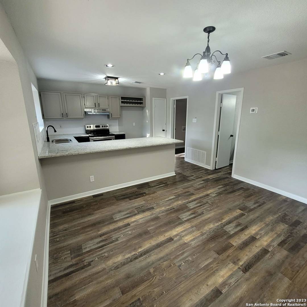 14623 Highland Ridge San Antonio, TX 78233 - Photo 15 of 37 a view of kitchen with sink microwave and refrigerator