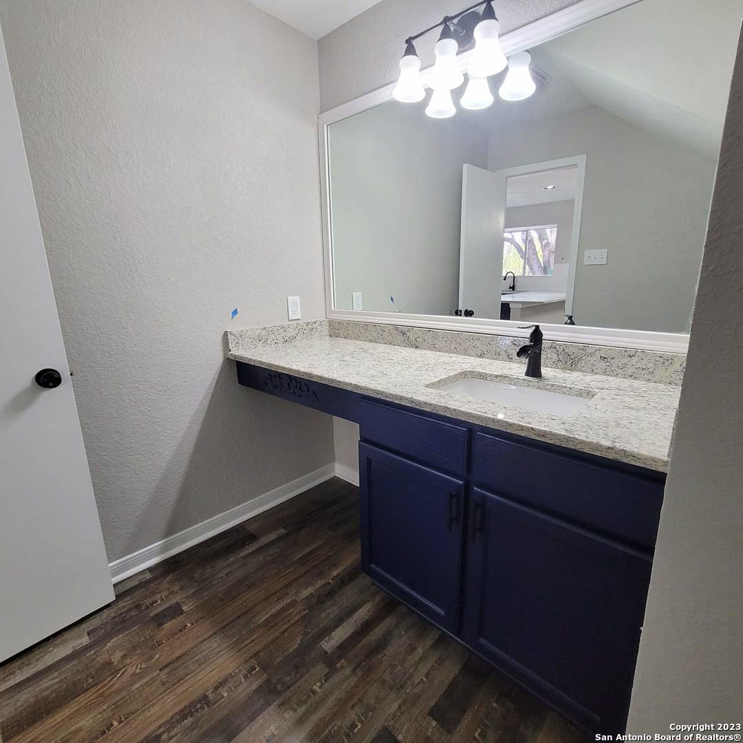 14623 Highland Ridge San Antonio, TX 78233 - Photo 20 of 37 a bathroom with a sink and a mirror