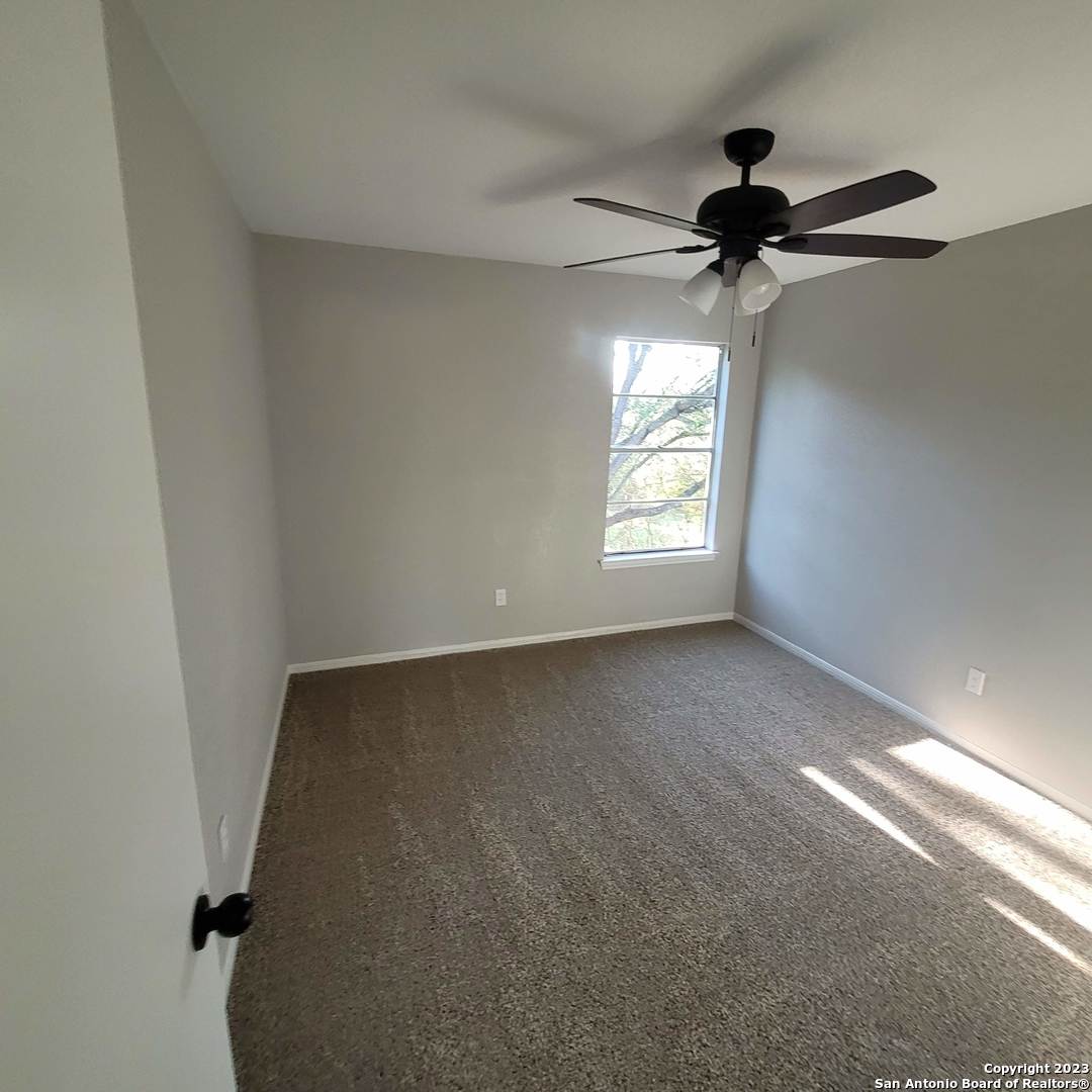14623 Highland Ridge San Antonio, TX 78233 - Photo 25 of 37 a view of an empty room and a window