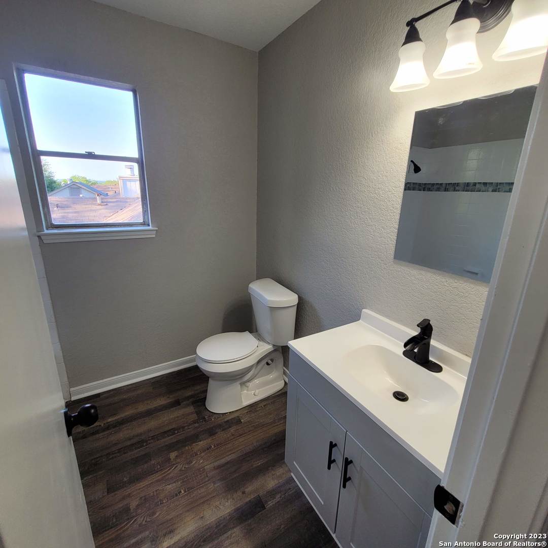 14623 Highland Ridge San Antonio, TX 78233 - Photo 28 of 37 a bathroom with a sink mirror and toilet