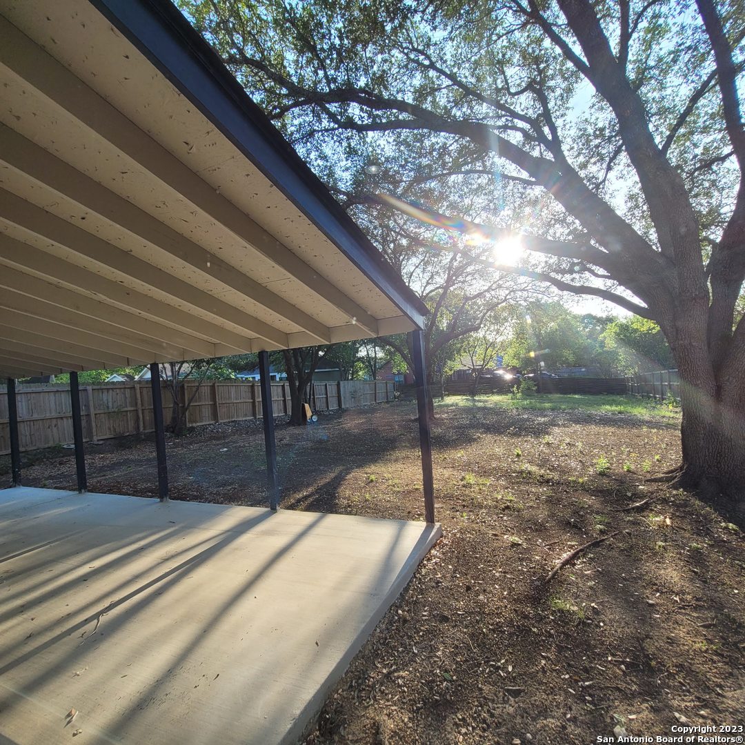 14623 Highland Ridge San Antonio, TX 78233 - Photo 36 of 37 a view of a backyard with a tree