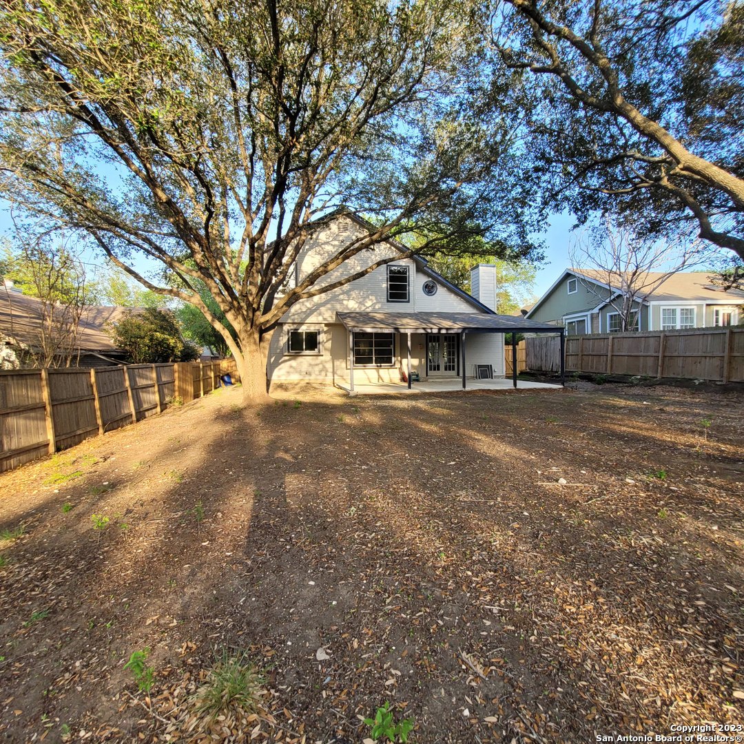 14623 Highland Ridge San Antonio, TX 78233 - Photo 37 of 37 a front view of a house with a large tree
