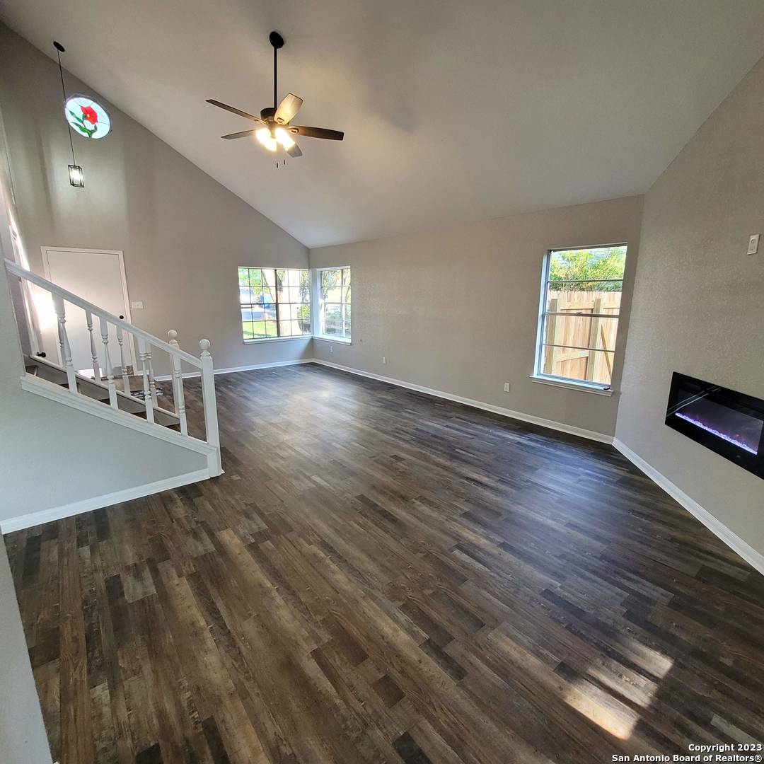 14623 Highland Ridge San Antonio, TX 78233 - Photo 10 of 37 wooden floor in an empty room with a window