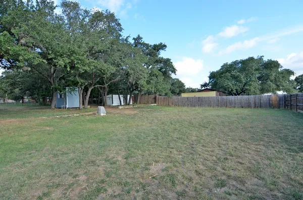 a view of outdoor space with deck and yard