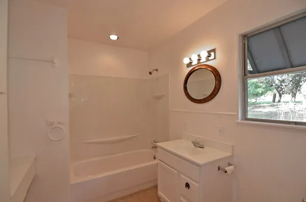 a bathroom with a sink a toilet and a bathtub