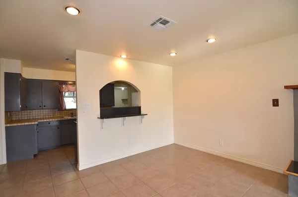 a view of a kitchen with a sink and dishwasher a refrigerator freezer