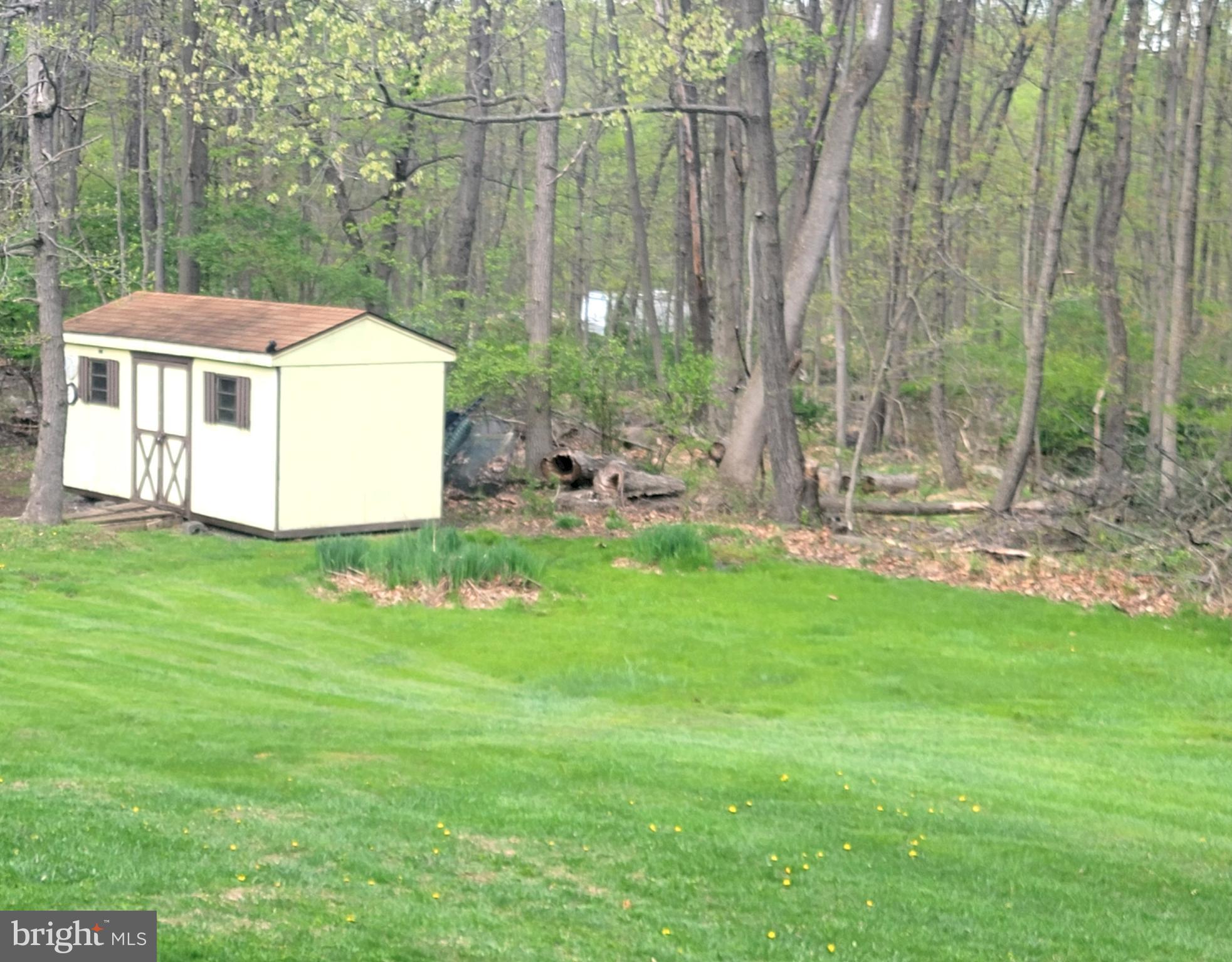 1313 Chestnut Hill Road Morgantown, PA 19543 - Photo 29 of 33 VIEW BACKYARD AND WOODED AREA