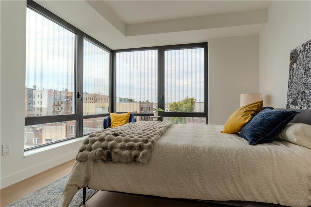 1807 66th Street, Unit 5B Brooklyn, NY 11204 - Photo 5 of 17 a bedroom with a bed and a large window