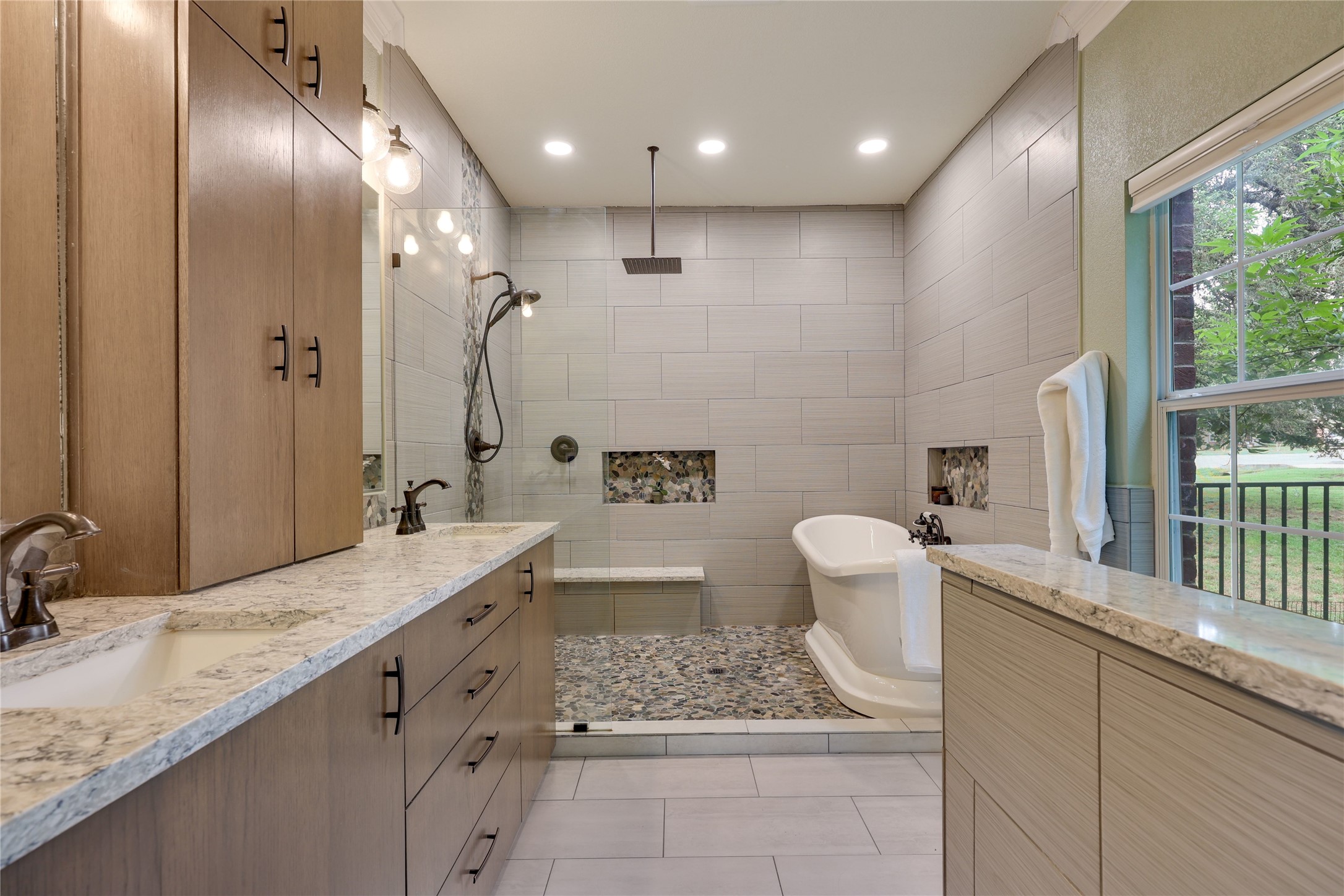 122 Avenida Brisa Fresca Road Kyle, TX 78640 - Photo 16 of 36 Spa-like primary bathroom with dual shower heads and luxurious soaking tub