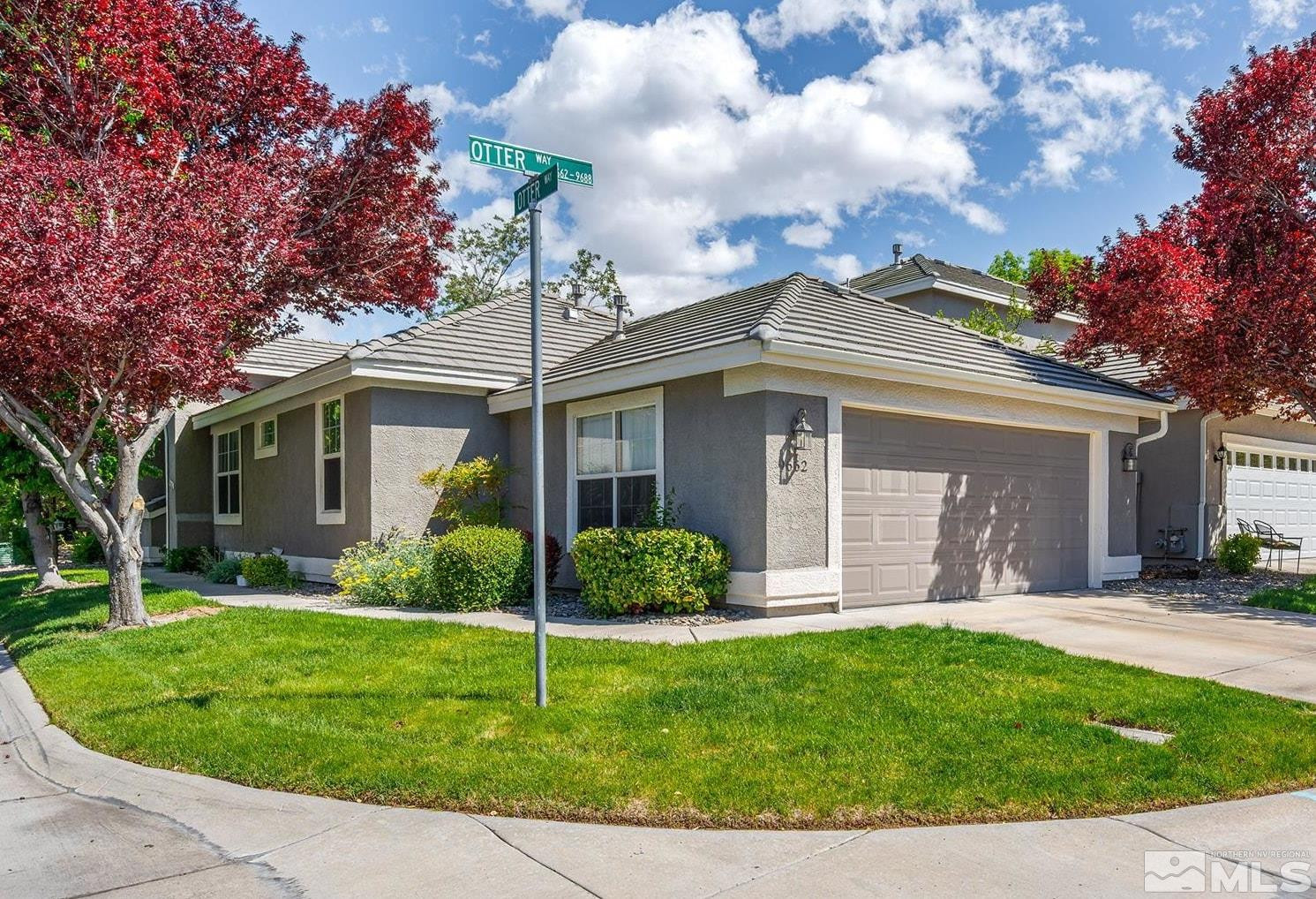 9662 Otter Way Reno, NV 89521 - Photo 1 of 19 front view of a house with a yard