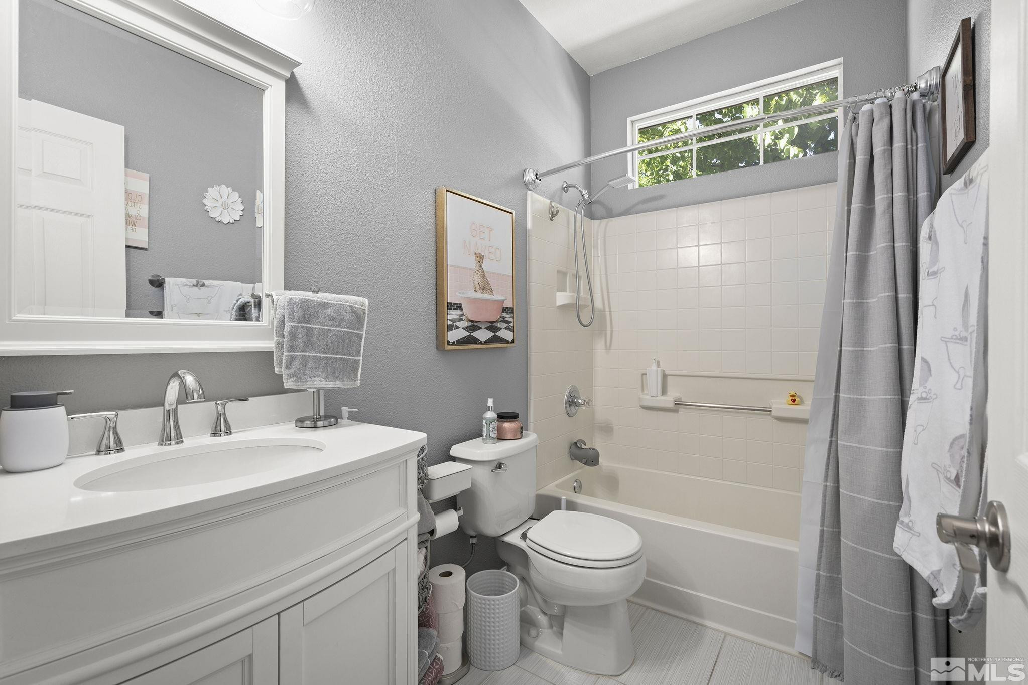 9662 Otter Way Reno, NV 89521 - Photo 12 of 19 a bathroom with a sink a toilet and shower