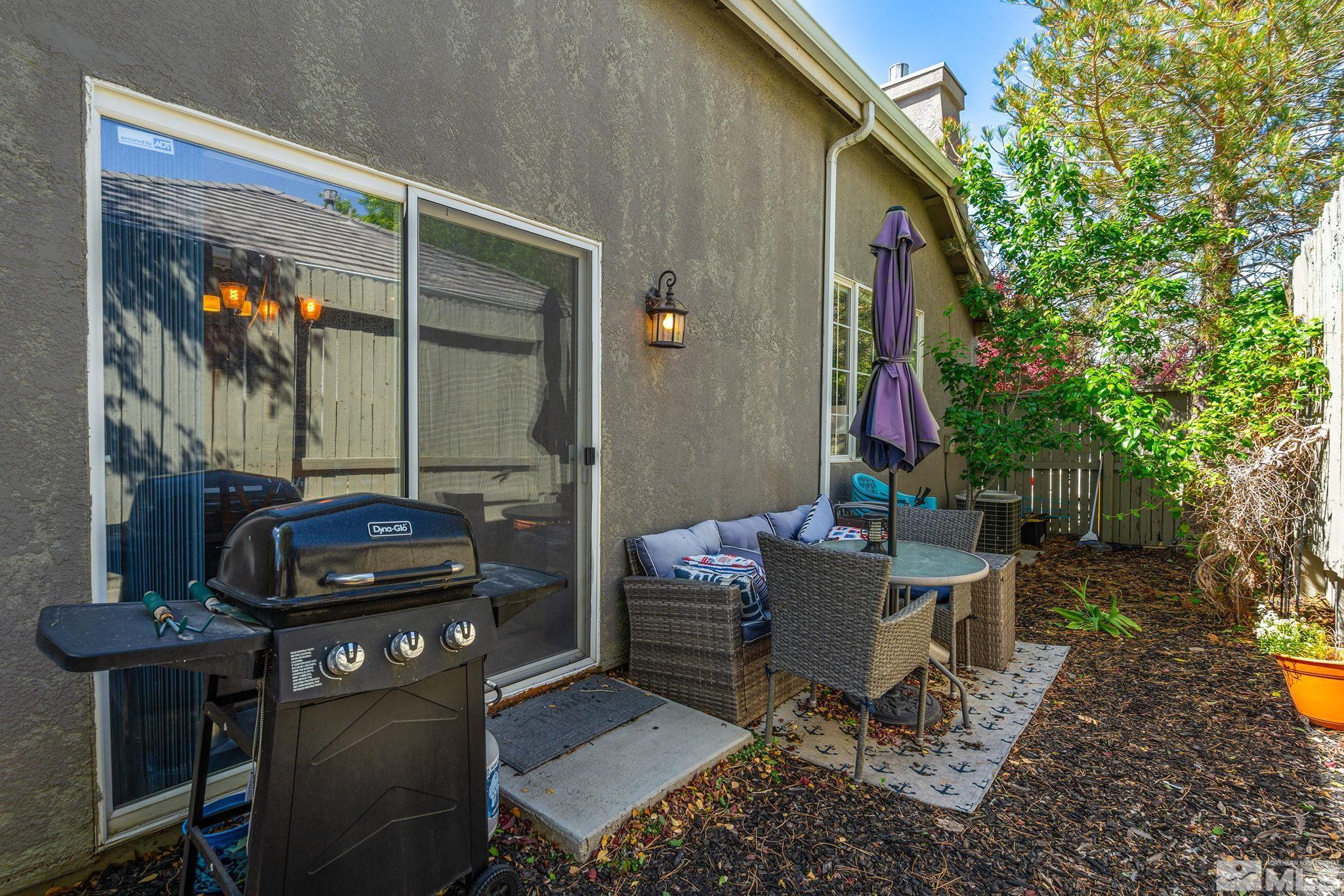 9662 Otter Way Reno, NV 89521 - Photo 14 of 19 a backyard of a house with outdoor seating