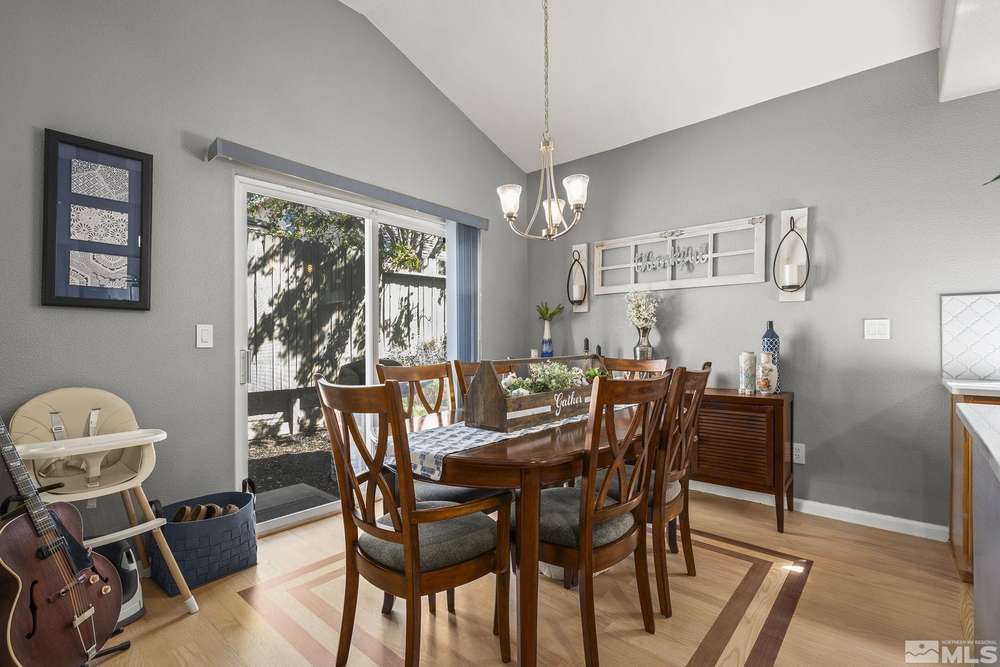 9662 Otter Way Reno, NV 89521 - Photo 8 of 19 a view of a dining room with furniture window and outside view