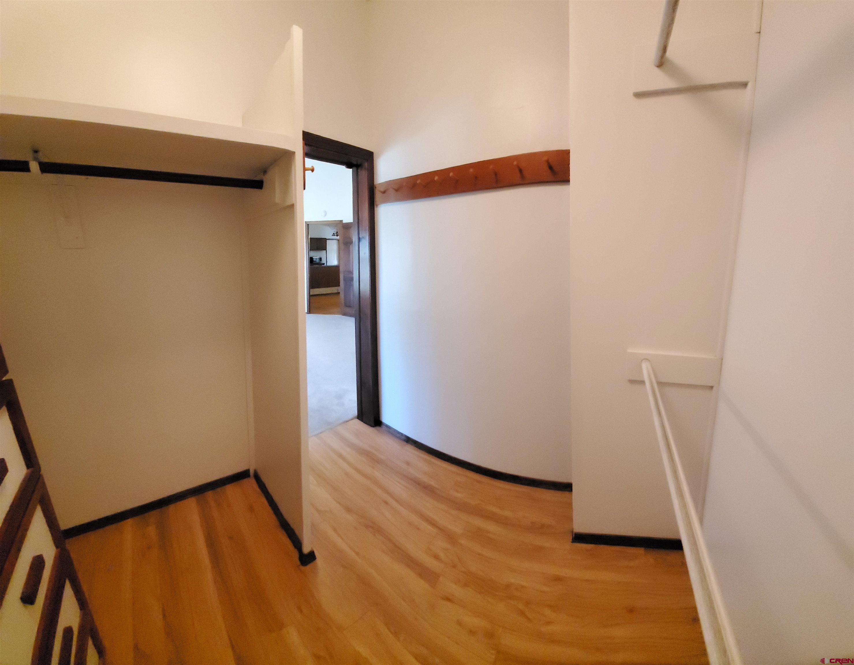 22250 County Rd M Cortez, CO 81321 - Photo 14 of 45 a view of an empty room with wooden floor and a window