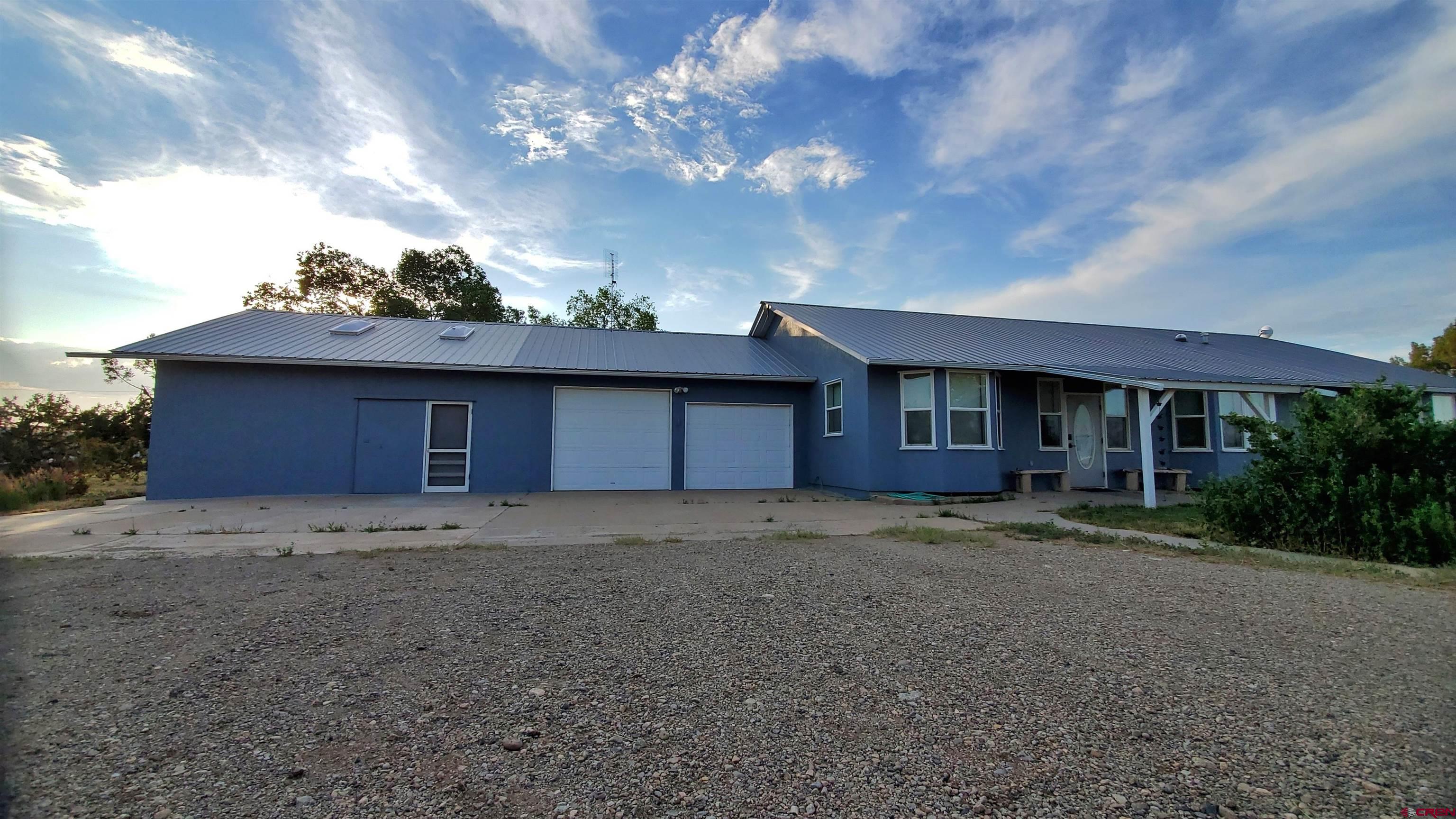 22250 County Rd M Cortez, CO 81321 - Photo 2 of 45 a view of a house with a yard