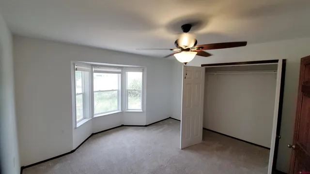 a view of walk in closet with living room