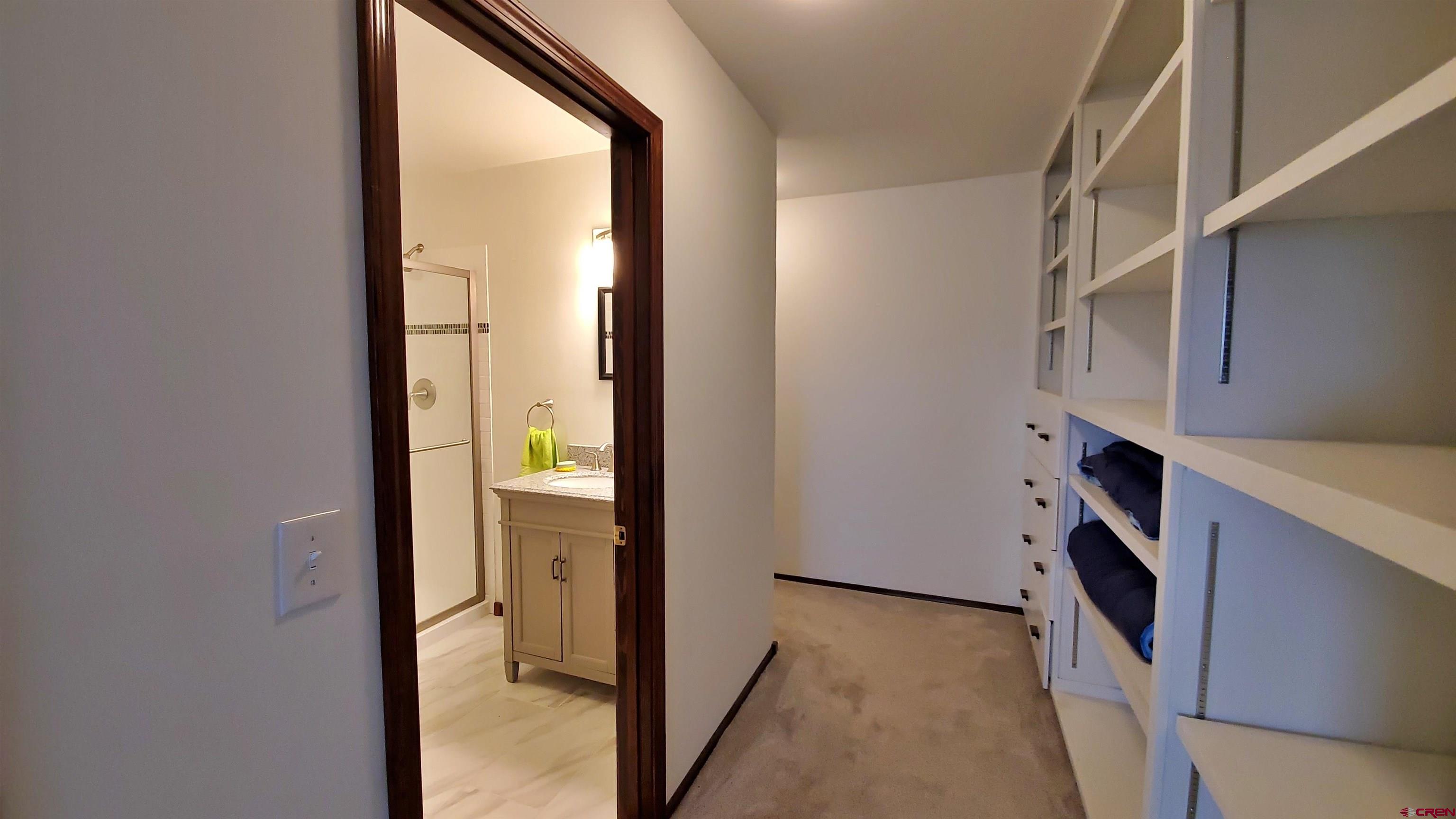 22250 County Rd M Cortez, CO 81321 - Photo 29 of 45 a view of walk in closet with living room