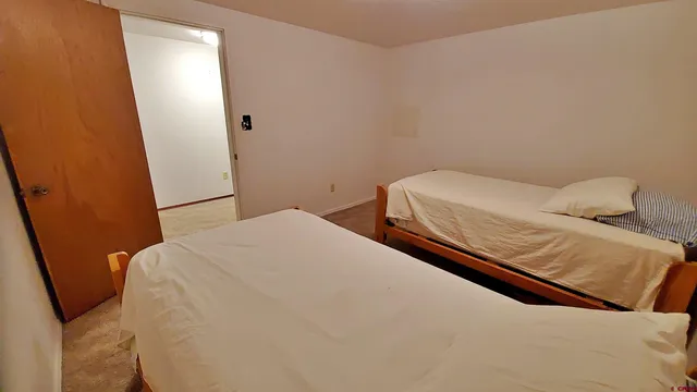 a view of empty room with closet and racks